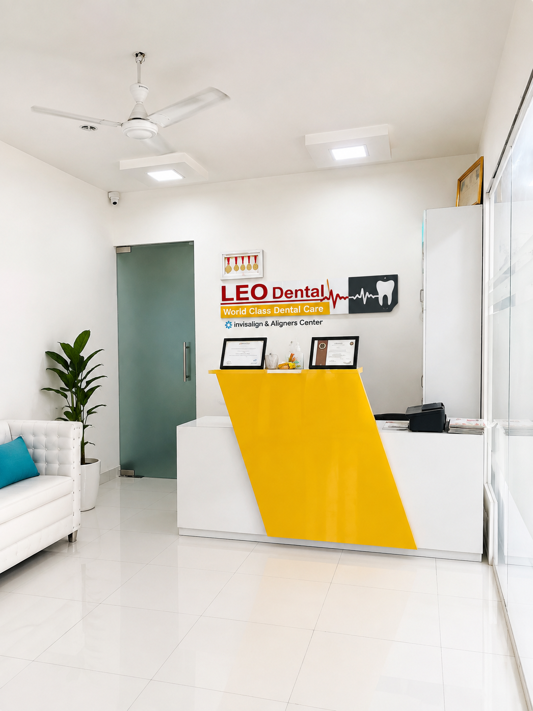 Leo Dental reception desk with branded signage and Invisalign aligners banner